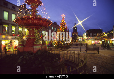 Christmas lights in Queensberry Square Dumfries town centre looking up to Mid Steeple Scotland UK Stock Photo