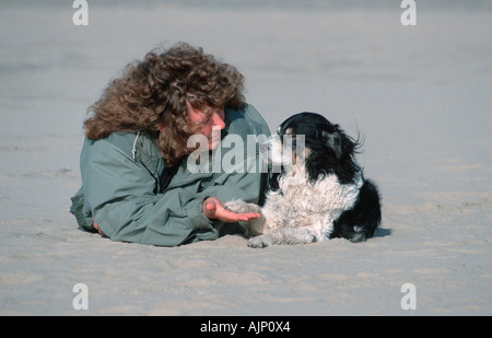 Woman and Mixed Breed Dog Stock Photo