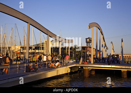 Barcelona Port Vell Rambla de Mar walkway crowds at sunset Stock Photo