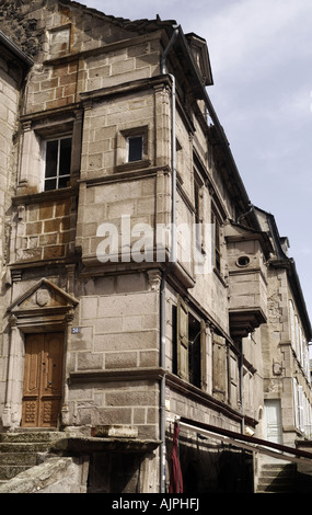 Doorway in Murat old town with triangular frontons with tympanum coat of arms and overhanging guardtower Stock Photo