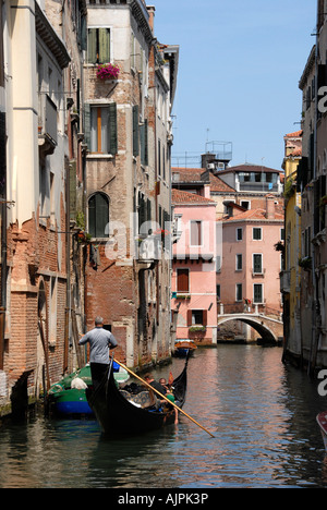 Gondola in small canal Venice Italy Stock Photo