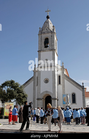 Pilgrims in front of Parish Church in Aljustrel, Portugal near Fatima. Parish Church of the Children Our Lady appeared to Stock Photo