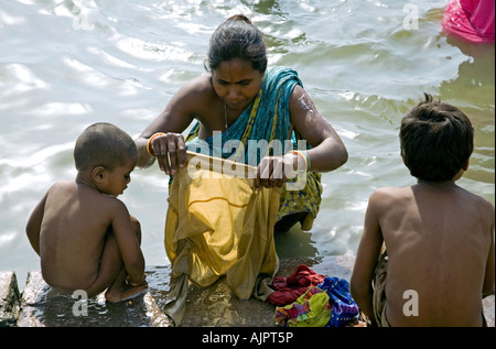 Mother washing her son. Ganges river. Rishikesh. Uttarakhand. India ...