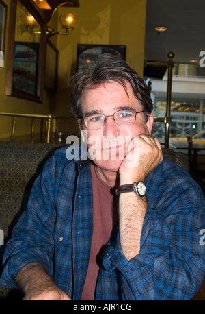 Portrait of man sitting in booth Stock Photo