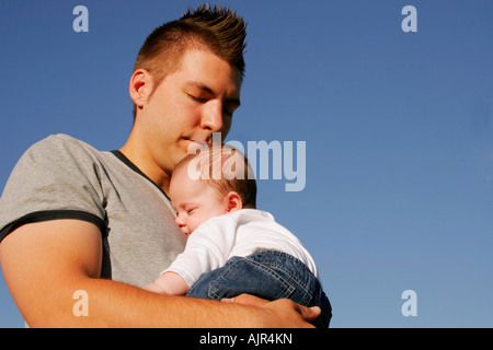 Man holding a baby Stock Photo