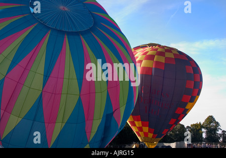 Closeup of 2 inflating balloons Stock Photo