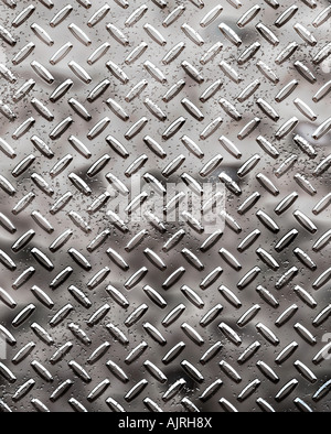 a very large sheet of rough black diamond plate with pits and marks Stock Photo