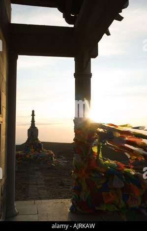 sunrise on a monastery stupa and prayer flags on Yedou Peak Wutaishan Shanxi province China Stock Photo
