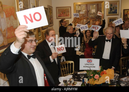 Black tie event formal charity dinner London Adults playing party games at the Cartoonist Dinner at The Mall Gallery London 2007 2000s UK HOMER SYKES Stock Photo