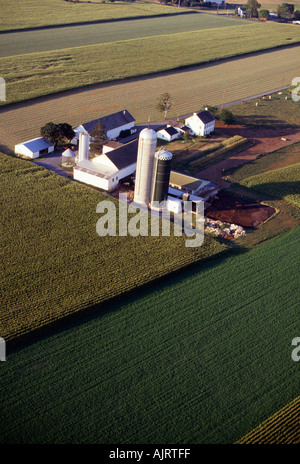 Aerial view of corn alfalfa and soybean crops around small dairy farm ...