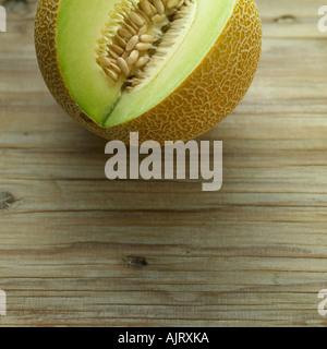 Galia melon on pale wooden background Stock Photo