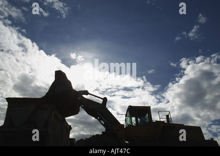 Silhouette of front end loader Stock Photo