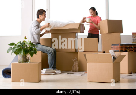 Young couple eating food and smiling Stock Photo