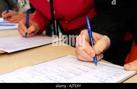 Members of the public signing a petition against cuts in mental health services, Kingston, Surrey, UK. Stock Photo