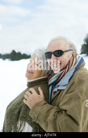 Senior couple embracing, smiling, outdoors, portrait Stock Photo