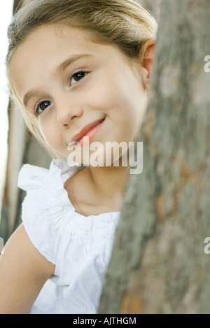 Girl smiling, looking away, head tilted, portrait Stock Photo