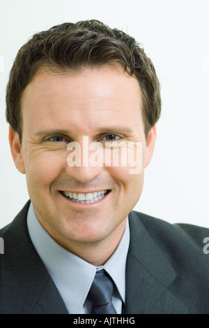 Businessman smiling at camera, portrait Stock Photo