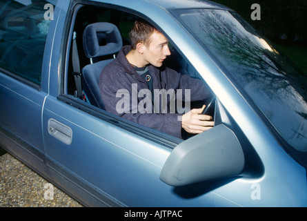 Young Man At Wheel Of Car Stock Photo