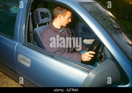 Young Man At Wheel Of Car Stock Photo