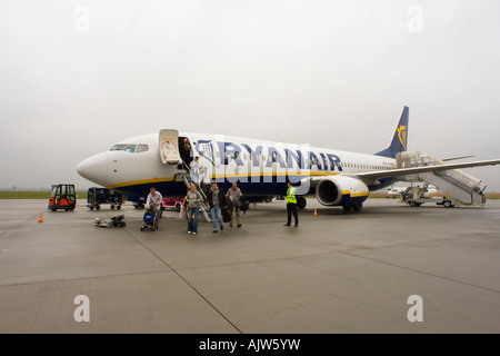 Passengers disembarking from Ryanair plane on airport tarmac at Jasionka Airport, Rzeszow, Poland Stock Photo