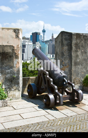 Iron Cannon Fortaleza do Monte Colonial Fort in Macau SAR Macau Tower in background Stock Photo