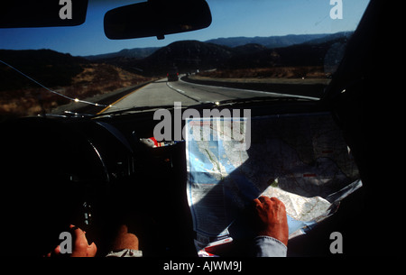 man map reading in car, Mexico Stock Photo