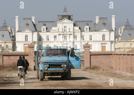 Maintenance staff arrive, and depart, from the Beijing Lafette Chateau, now a hotel, outside Beijing. Stock Photo