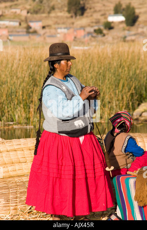 Uros Iruitos Indian woman living on Phuwa island a floating reed island on Lake Titicaca, Bolivia