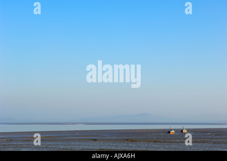 Morecambe Bay looking out to sea with the Lake District in the background Stock Photo