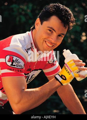 Lifestyle. Outdoor close-up of young man on bicycle. Stock Photo