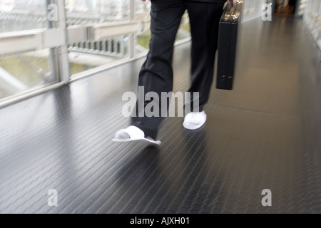 Business man wearing slippers Stock Photo