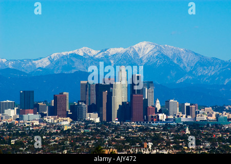 Snow covered San Gabriel Mountains behind downtown Los Angeles skyline California Stock Photo