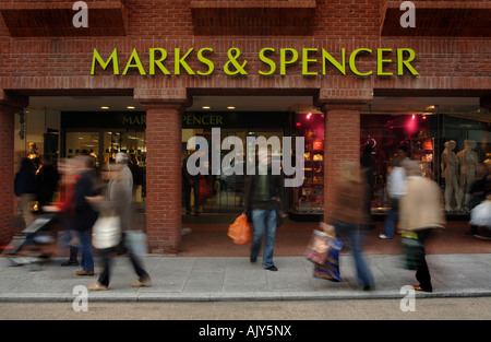 people wlaking past the front of the Marks & Spencer store in Exeter, Devon. Stock Photo