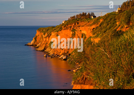 Dawn light on cliffs at Cap Canon, Percé, QC Quebec, Canada Stock Photo