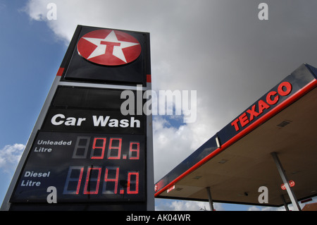 Fuel prices displayed on petrol pumps at 99.8p petrol and 89p diesel at a Texaco garage