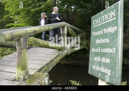 UK England Northumberland,Rothbury,Cragside,The National Trust,inventor Lord Henry Armstrong,sign,treated bridge timbers,UK071004037 Stock Photo