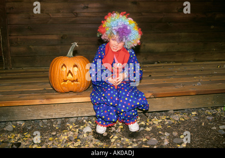 A young girl dressed in a clown costume Stock Photo