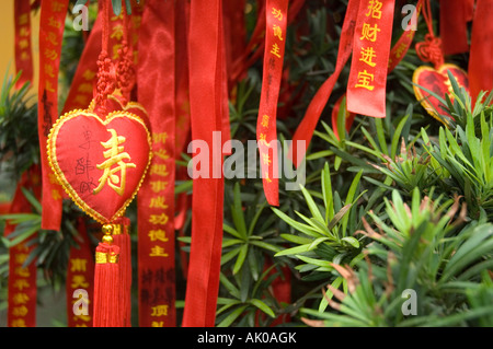 Longevity heart and ribbons adorned with religious pseudonyms used as offerings in a Buddhist temple China Stock Photo