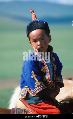 Mongolian boy on horse Stock Photo