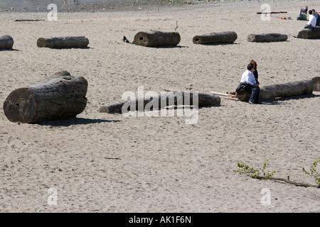 vancouver beach stanely park with logs and people Stock Photo