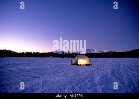 Cross country skiers set up their tent in mid winter near Mount Bachelor in the Cascade Mountains near Bend Stock Photo
