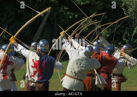 Medieval longbow archers reenacting the siege of Berkeley Castle with shooting of voiles of arrows Stock Photo