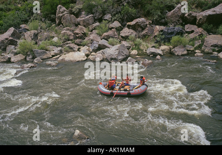 Visitors ride the rapids of the Rio Grande in the upper Rio Grande Valley north of Santa Fe Stock Photo