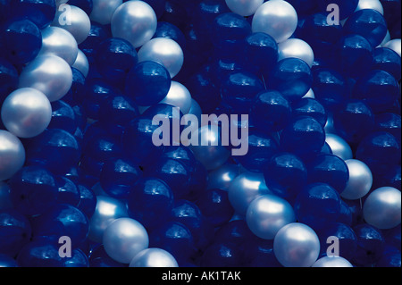 Close-up of many blue and white balloons bunched together. Stock Photo