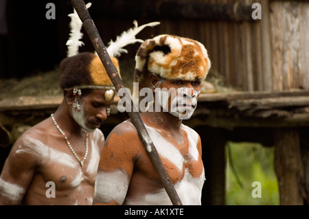 Asmat tribal men in killing evil soul ceremony, Omandeseb, Irian Jaya Indonesia. Stock Photo