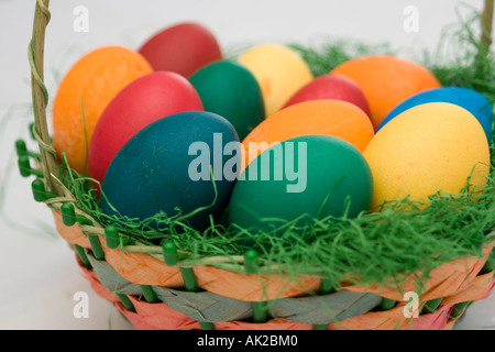 Dyed eggs lying in an easter basket Stock Photo