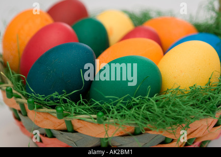Dyed eggs lying in an easter basket Stock Photo