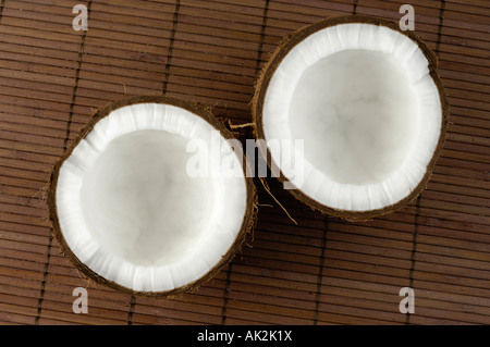 Coconut cracked in two halves Stock Photo