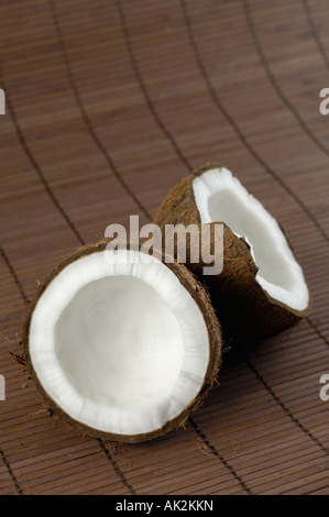 Coconut cracked in two halves Stock Photo