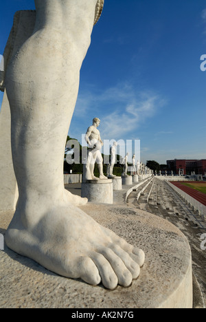 Rome Italy Giant marble statues of male athletes in the fascist era Stadio dei Marmi in the Foro Italico sports complex Stock Photo
